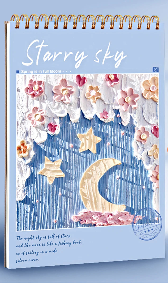 Starry sky-themed A4 sketchbook with stationery items on a light blue background